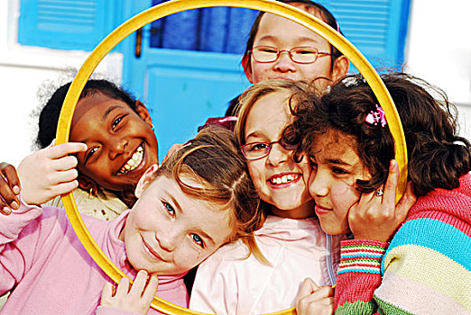 libya,tripoli,group,of,smiling,girls,looking,through,hula,hoop