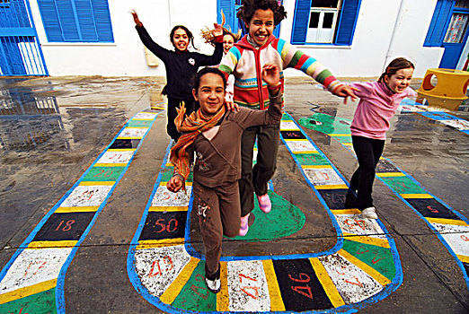 libya,tripoli,children,of,mixed,race,jumping,out,happiness