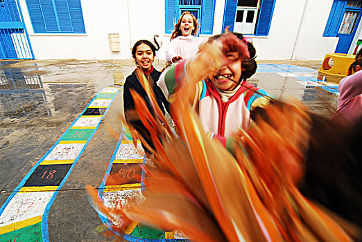 libya,tripoli,children,of,mixed,race,jumping,out,happiness