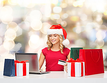 圣诞节,休假,科技,购物,概念,微笑,女人,圣诞老人,帽子,礼物,信用卡,笔记本电脑,上方,背景