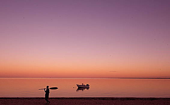 madagascar,tulear,ifaty,pink,sunrise,with,boat,at,the,beach