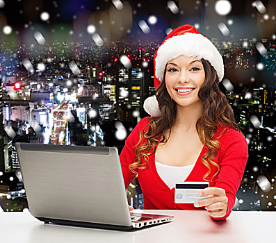 圣诞节,休假,科技,购物,概念,微笑,女人,圣诞老人,帽子,信用卡,笔记本电脑,上方,雪,夜晚,城市,背景