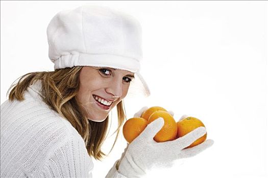 女青年,戴着,白人,帽子,拿着,橘子