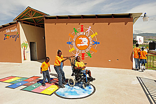 haiti,port,au,prince,handicapped,child,playing,in,school,yard,hopscotch