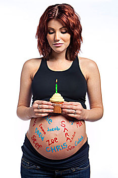 孕妇,书写,上方,裸露,腹部,拿着,杯形蛋糕,燃烛,艾伯塔省,加拿大