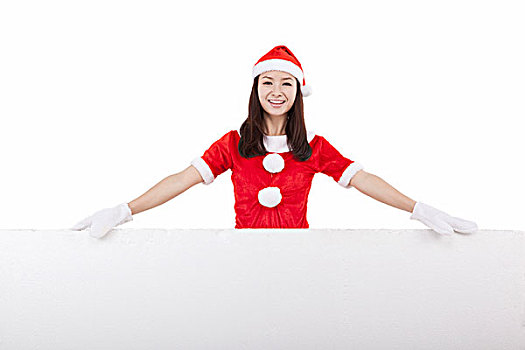 穿圣诞装的青年女子和巨大的白板