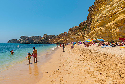 洗澡,沙滩,蓝绿色海水,崎岖,岩石海岸,砂岩,岩石构造,海中,阿尔加维,拉各斯,葡萄牙,欧洲