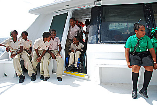 dominica,roseau,handicapped,boy,in,wheelchair,making,part,of,the,boattrip,to,unicef,-,environmental,network,whalewatching