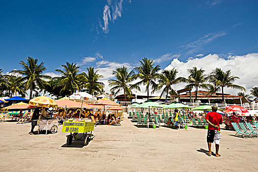 brazil,pernambuco,porto,de,galinhas,tourist,on,the,beach,under,parasols
