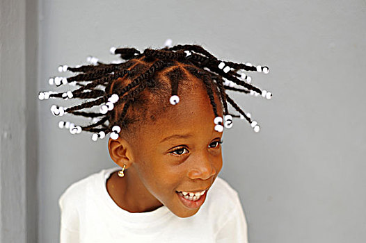 dominica,roseau,preschool,social,center,portrait,of,smiling,girl,with,braids