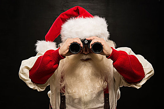 圣诞老人,双筒望远镜,深色背景