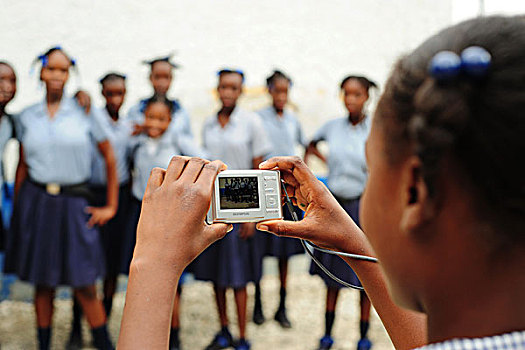 haiti,croix,des,bouquets,girl,taking,photograph