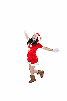 穿圣诞装的青年女子跳跃
