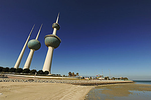 kuwait,city,towers,along,small,beach,is,a,group,of,three,reinforced,concrete,in,the,main,tower,i