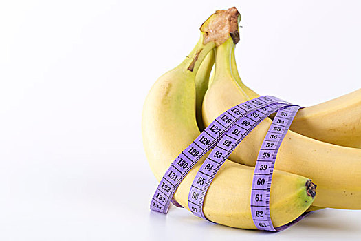 香蕉和测量带,健康饮食概念