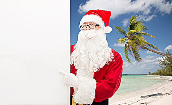 圣诞节,休假,广告,手势,旅行,人,概念,男人,服饰,圣诞老人,指向,白色,留白,广告牌,上方,热带沙滩,背景
