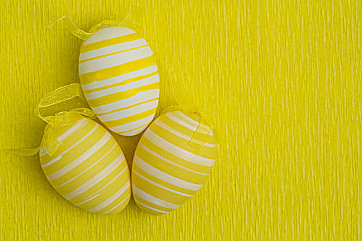 三个,复活节彩蛋,黄色背景