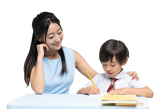 年轻女老师辅导小男孩学习