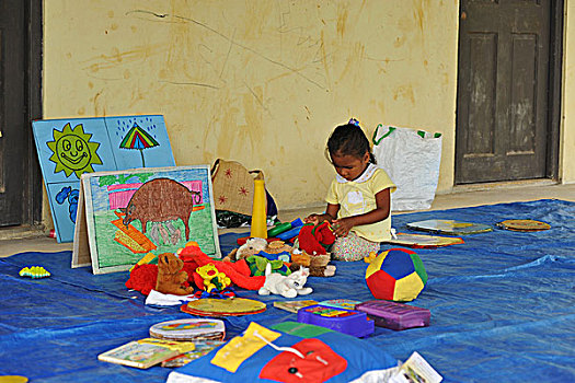 dominica,carib,territory,little,girl,playing,with,toys