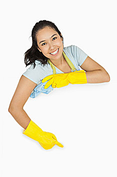 高兴,女清洁工,橡胶手套,围裙,指向,白色,表面