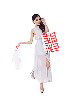 young,woman,carrying,shopping,bags