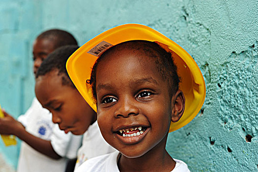 dominica,roseau,preschool,ccf,portrait,of,young,girl,with,a,construction,worker,hat