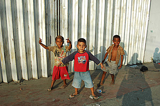 group,of,timorese,children,in,the,street,with,naked,boy,background
