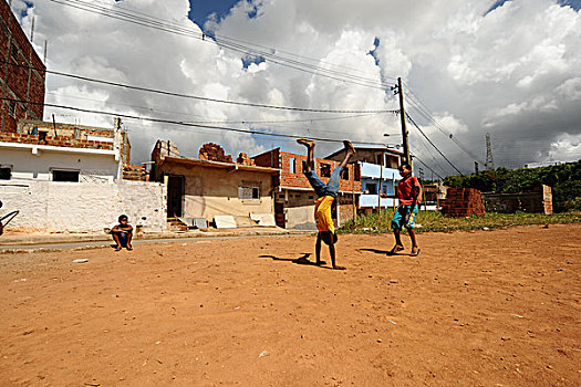 brazil,bahia,salvador,young,boys,showing,off,handstand