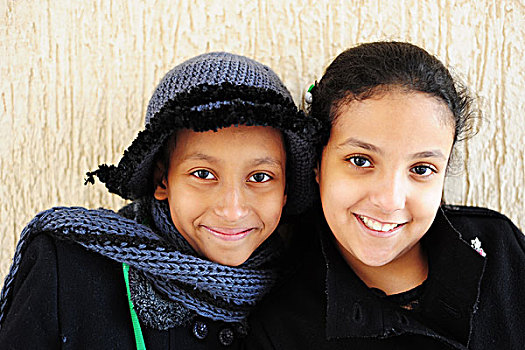 kuwait,city,portrait,of,2,happy,schoolgirls