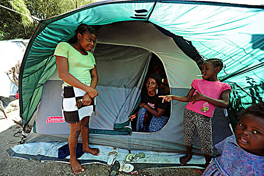 haiti,port,au,prince,portrait,of,children,in,front,tent,refugee,camp