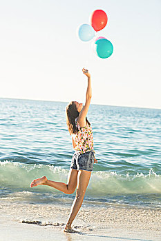 高兴,女孩,玩,沙子,气球,海滩