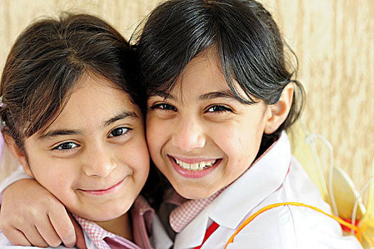 kuwait,city,portrait,of,2,happy,schoolgirls