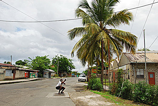 dominica,morne,trois,pitons,man,surfing,on,the,street