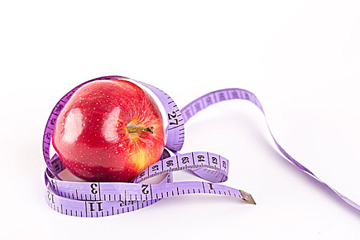 健康概念,一个苹果和软尺
