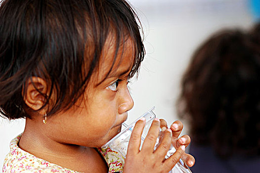 timorese,girl,with,glass,of,water