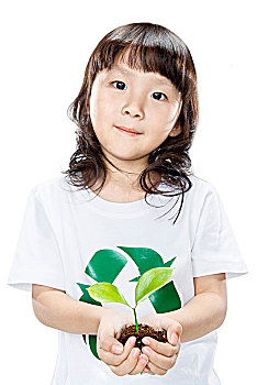 穿白体恤手捧植物的小女孩