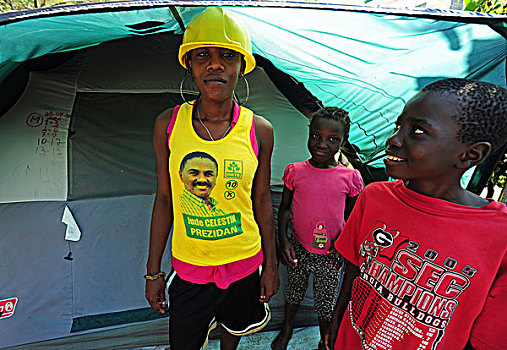 haiti,port,au,prince,portrait,of,children,in,front,tent,refugee,camp