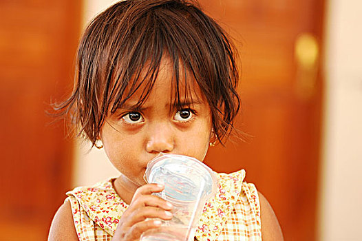 portrait,of,blond,timorese,girl,with,dark,eyes