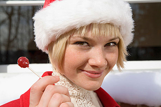 女青年,穿,圣诞帽,拿着,棒棒糖