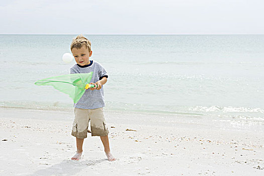 男孩,站立,海滩,尝试,抓住,球,网