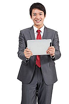 棚拍商务装年轻男人使用平板电脑