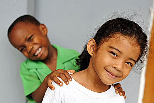 dominica,roseau,preschool,social,center,portrait,of,young,girl,and,boy