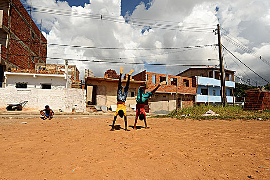 brazil,bahia,salvador,young,boys,showing,off,handstand