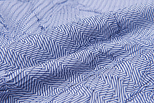 浅蓝色褶皱条纹布料背景