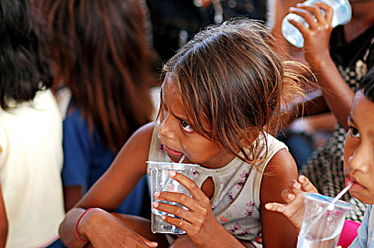 east-timor,timor-leste,dili,portrait,of,timorese,boy,smiling,with,white,teeth,and,brown,eyes