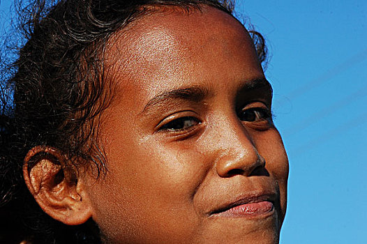 portrait,of,a,timorese,girl,looking,down