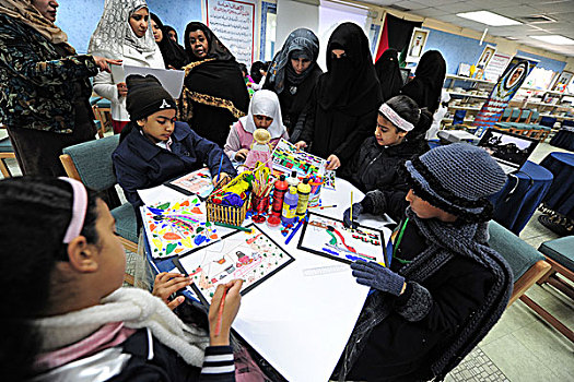 kuwait,city,drawing,activities,in,classroom,with,supervising,teachers,burqa