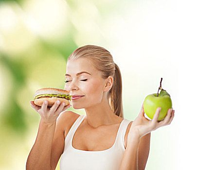健康,节食,概念,女人,嗅,汉堡包,拿着,苹果