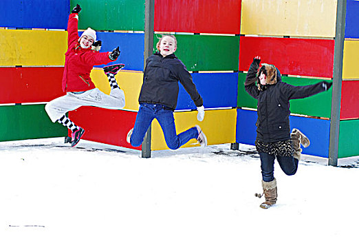 iceland,reykjavik,girls,jumping,in,the,snow,with,colored,background