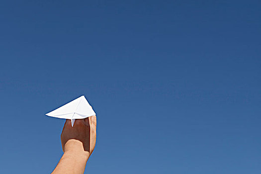 握着,纸飞机,蓝天